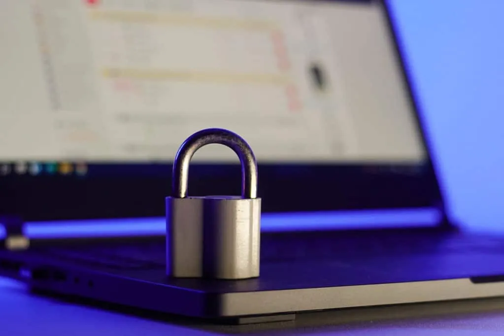 the image shows a laptop with a lock pad over it